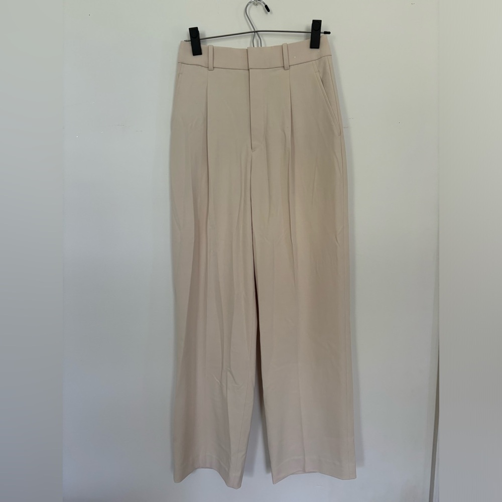 Off white pleated wide leg trousers